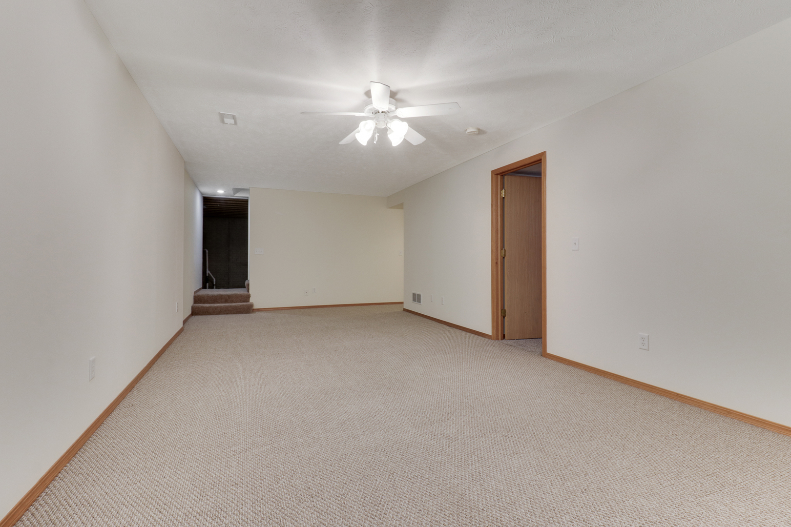 205 Martin Street Normal, IL 61761 - Photo 20 of 32 an empty room with a ceiling fan and a window