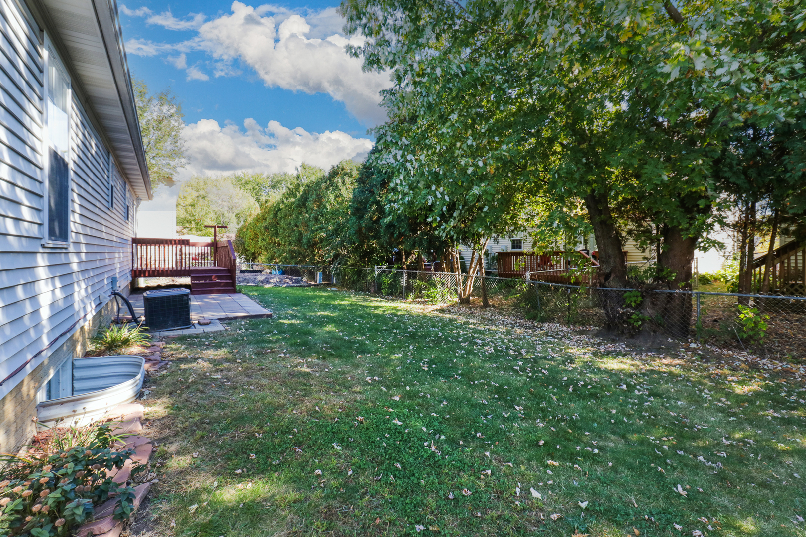 205 Martin Street Normal, IL 61761 - Photo 30 of 32 a backyard of a house with lots of green space