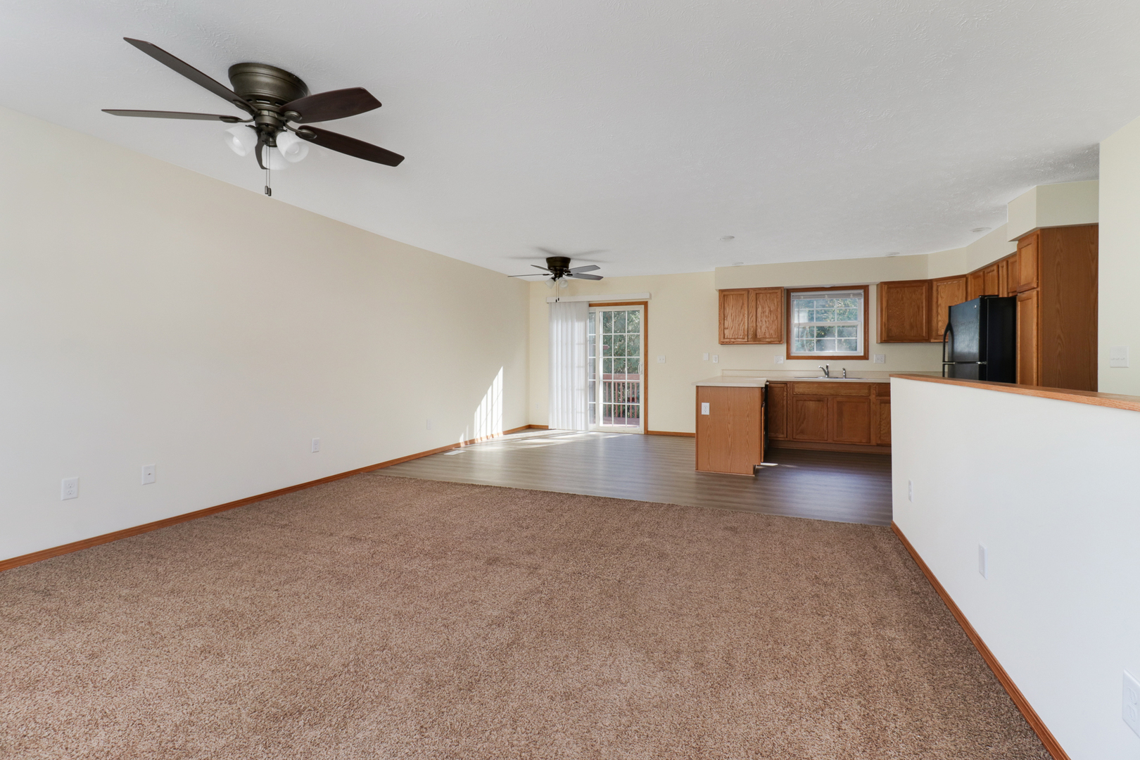 205 Martin Street Normal, IL 61761 - Photo 3 of 32 a view of empty room with a kitchen