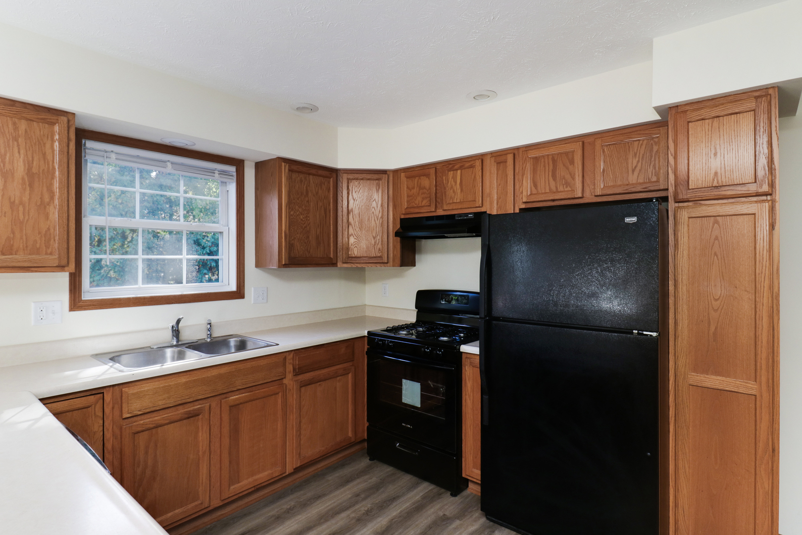 205 Martin Street Normal, IL 61761 - Photo 9 of 32 a kitchen with a refrigerator and a sink