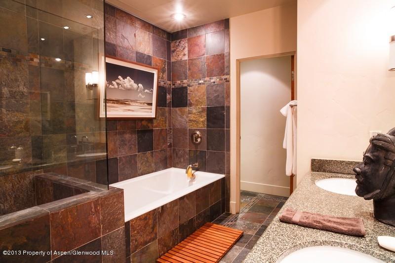231 Robinson Street, Unit 325 Basalt, CO 81621 - Photo 13 of 16 a bathroom with a bathtub and a shower
