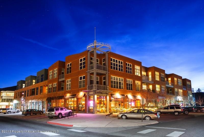 231 Robinson Street, Unit 325 Basalt, CO 81621 - Photo 3 of 16 a city street lined with parked cars and buildings