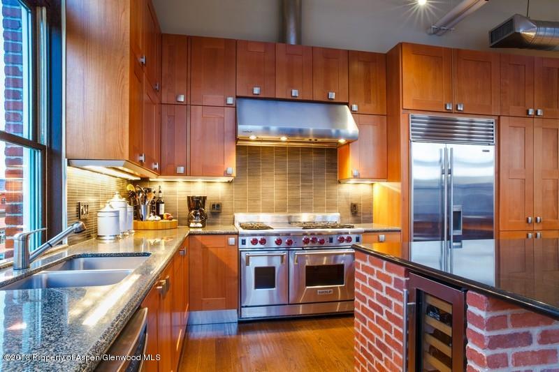 231 Robinson Street, Unit 325 Basalt, CO 81621 - Photo 6 of 16 a kitchen with a stove and a sink