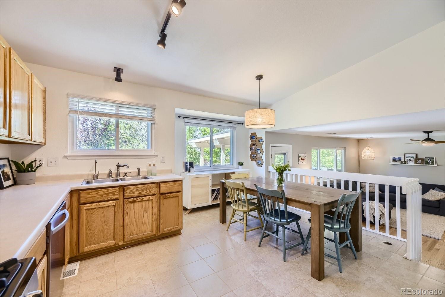 9744 South Castle Ridge Circle Highlands Ranch, CO 80129 - Photo 13 of 28 a view of a dining room with furniture window and outside view