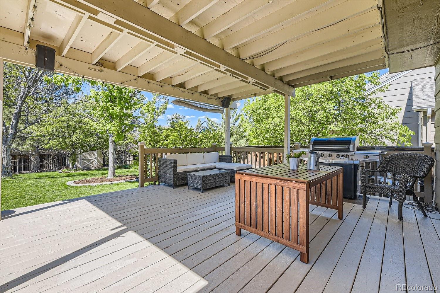 9744 South Castle Ridge Circle Highlands Ranch, CO 80129 - Photo 24 of 28 a view of a deck with wooden floor and outdoor space