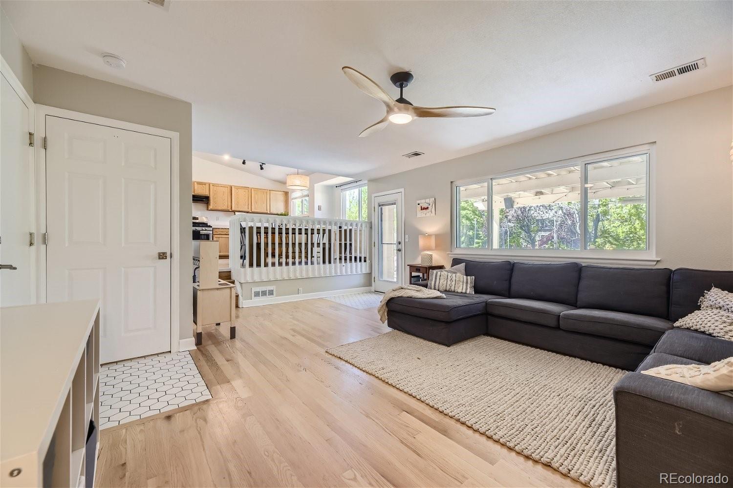 9744 South Castle Ridge Circle Highlands Ranch, CO 80129 - Photo 6 of 28 a living room with furniture and a large window