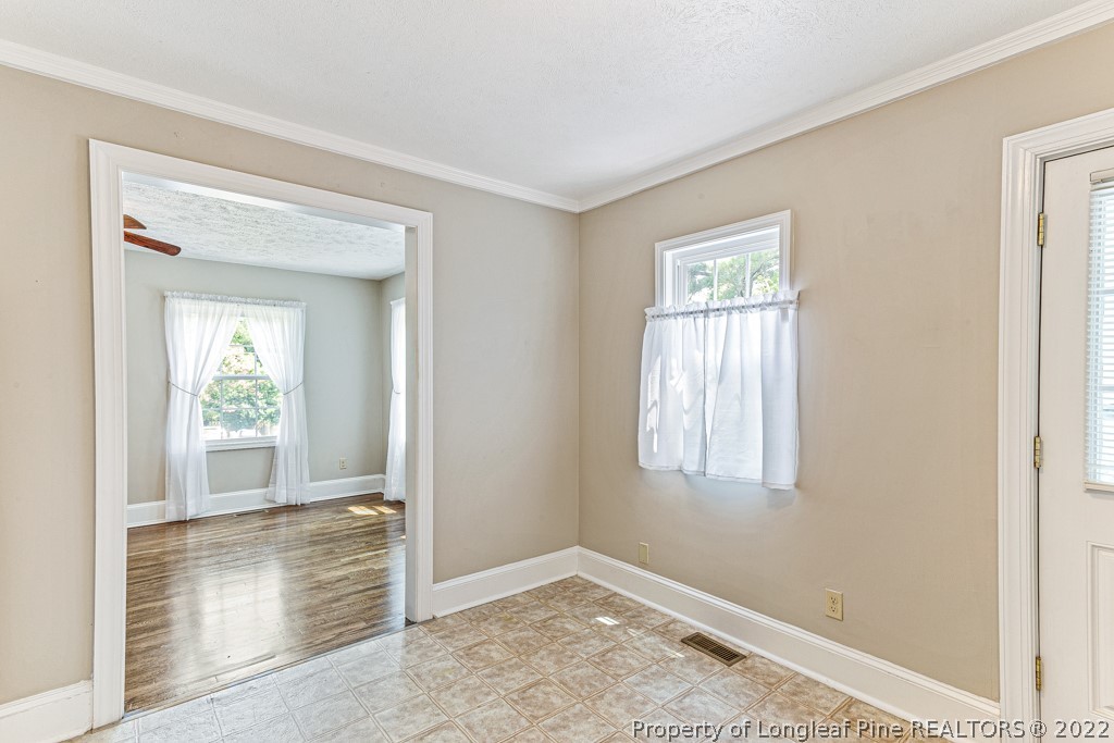 911 Anarine Road Fayetteville, NC 28303 - Photo 12 of 32 an empty room with windows