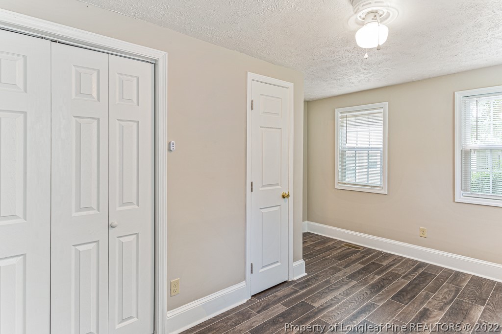 911 Anarine Road Fayetteville, NC 28303 - Photo 15 of 32 a view of a livingroom with wooden floor and a window