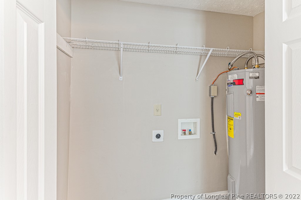 911 Anarine Road Fayetteville, NC 28303 - Photo 16 of 32 a utility room with dryer and washer