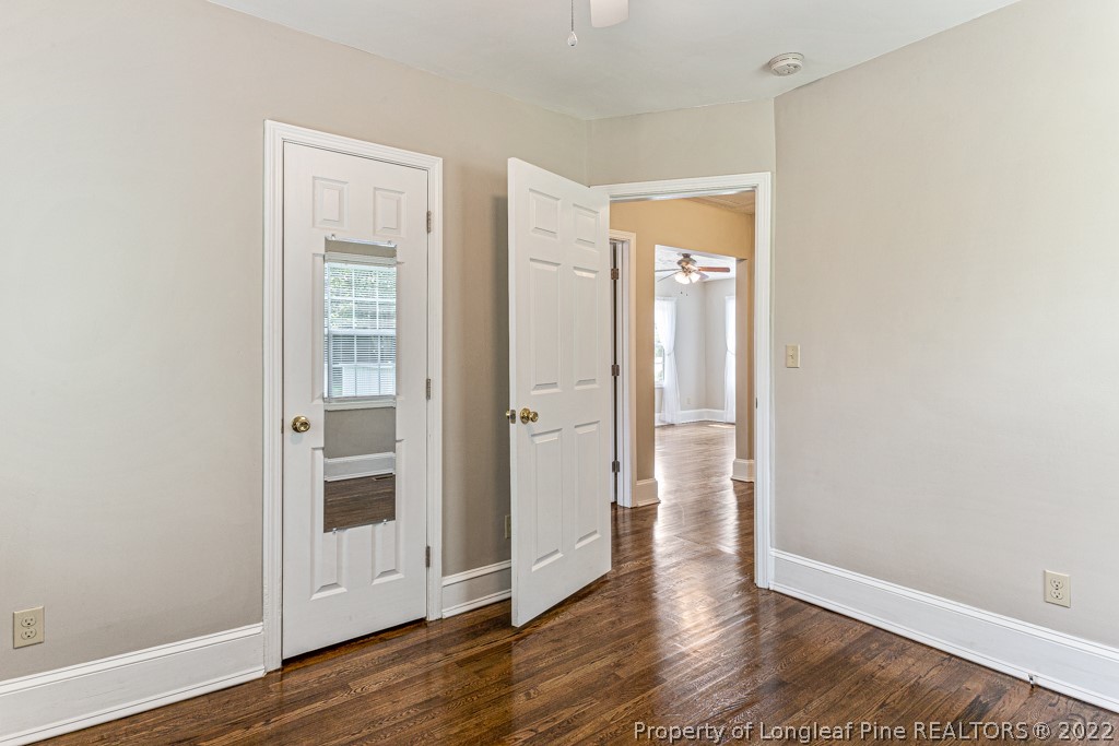 911 Anarine Road Fayetteville, NC 28303 - Photo 20 of 32 an empty room with wooden floor and entrance