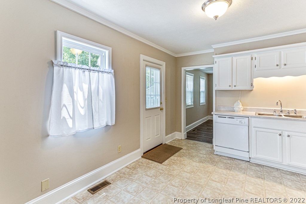 911 Anarine Road Fayetteville, NC 28303 - Photo 9 of 32 a room with a bed and a window
