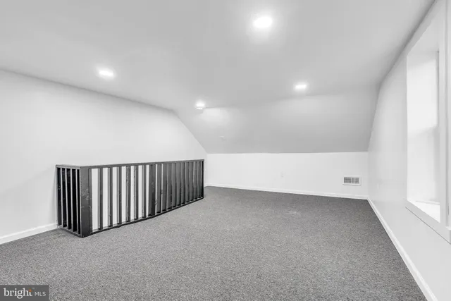 a view of a patio with couches and a fire pit