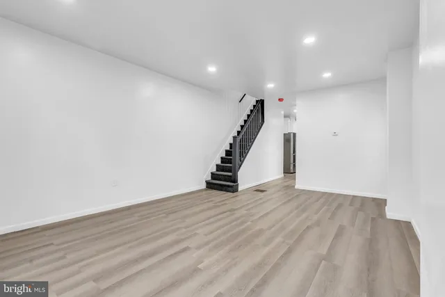 a view of an empty room with stairs