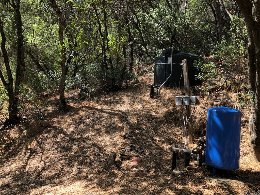 4901 Miller Road Mariposa, CA 95338 - Photo 1 of 1 Well and water storage tank.