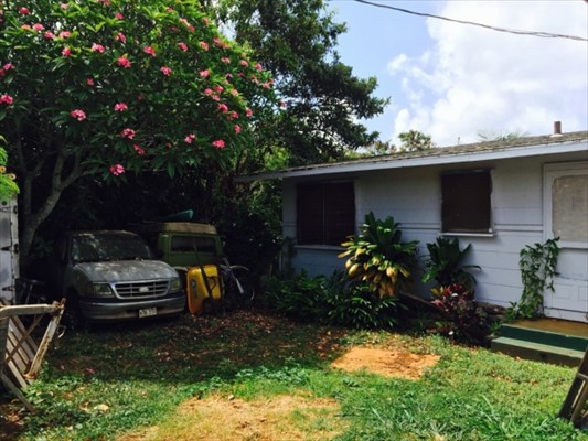 4953 La Road Kapaa, HI 96746 - Photo 8 of 21 a backyard of a house with barbeque oven table and chairs