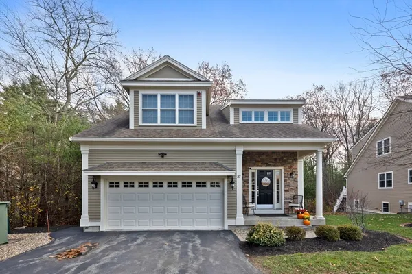front view of a house with a yard