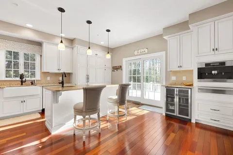 a large kitchen with stainless steel appliances a lot of counter space and a sink
