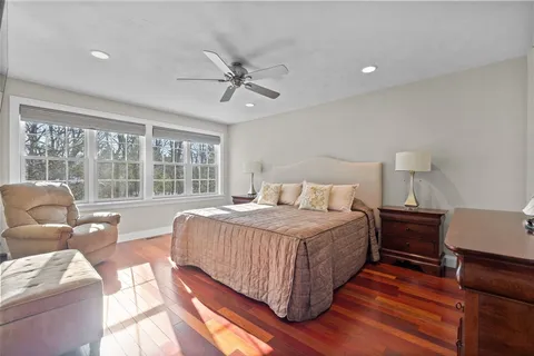 a bedroom with a bed and a couch
