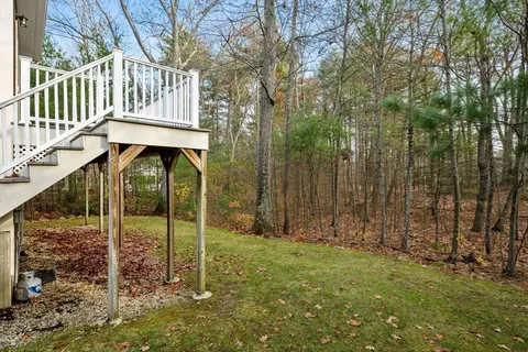 a view of a deck with a backyard