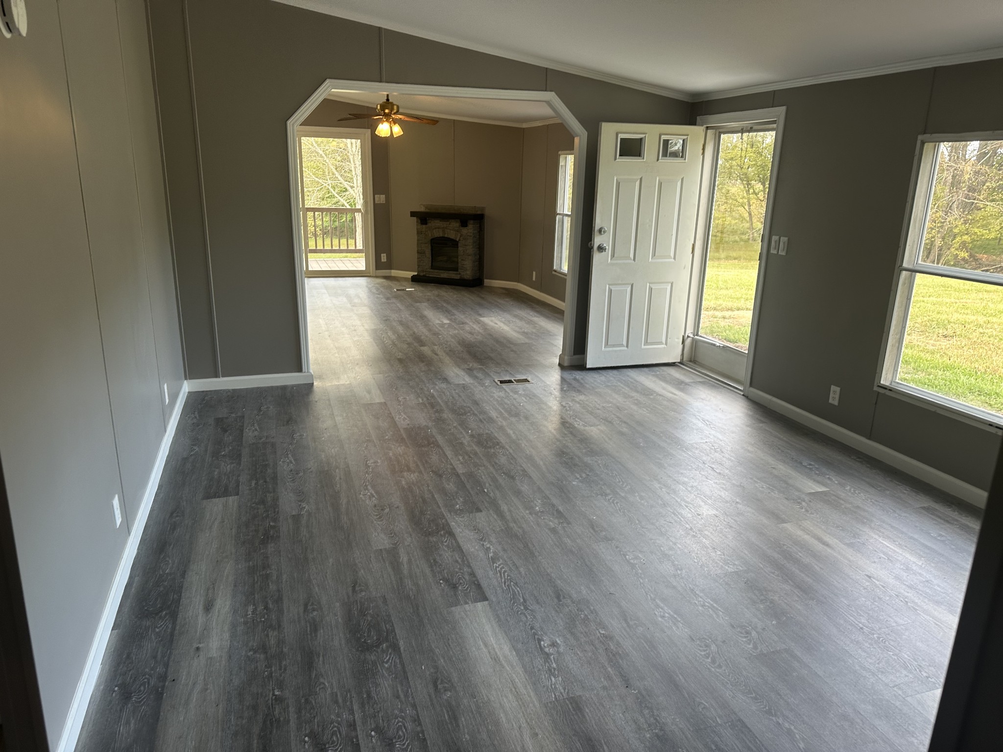 6409 Roy Pearson Road Springfield, TN 37172 - Photo 14 of 22 an empty room with wooden floor and windows