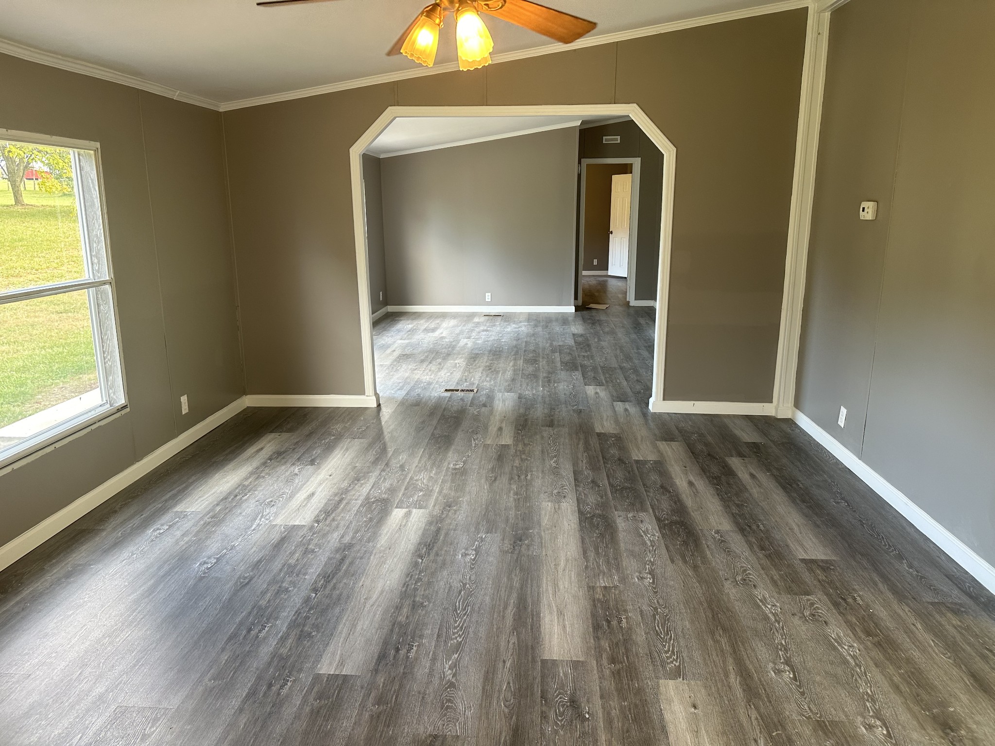 6409 Roy Pearson Road Springfield, TN 37172 - Photo 15 of 22 a view of empty room with wooden floor and fan