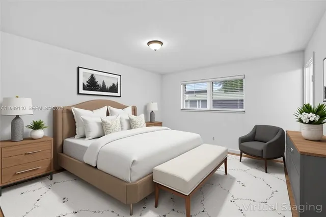 a bedroom with bed chair and window