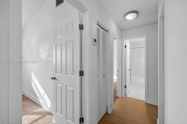 a view of a hallway with a room