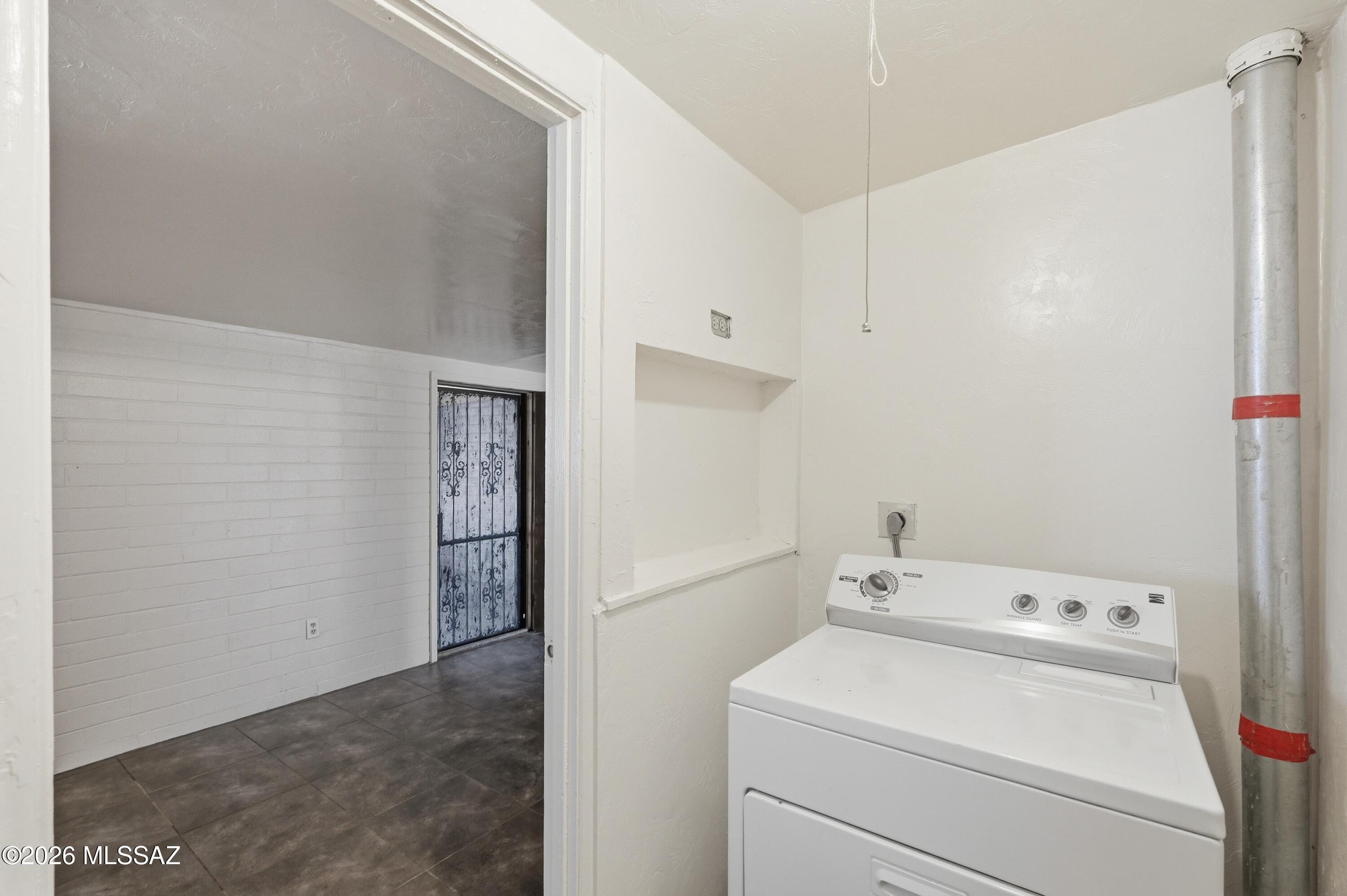 1808 West Caravelle Road Tucson, AZ 85713 - Photo 30 of 38 a utility room with dryer and washer