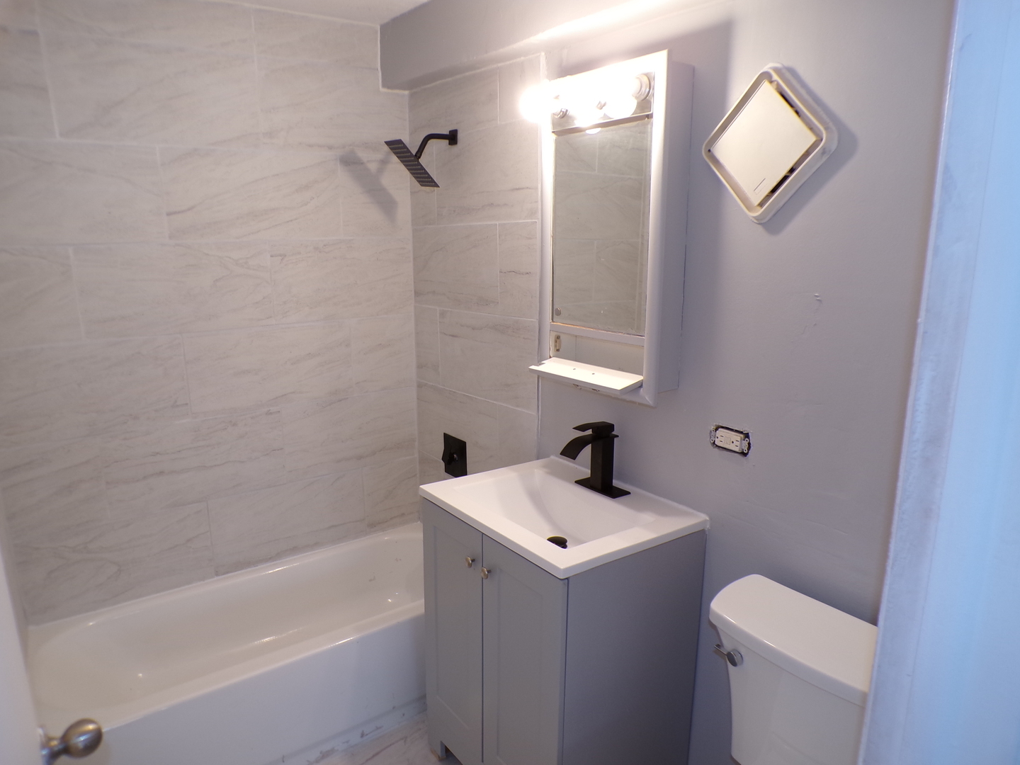 12548 Fairview Avenue, Unit 2B Blue Island, IL 60406 - Photo 10 of 10 a bathroom with a sink toilet and shower