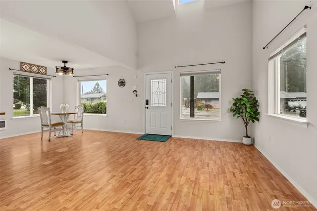 a view of a livingroom with furniture and a window