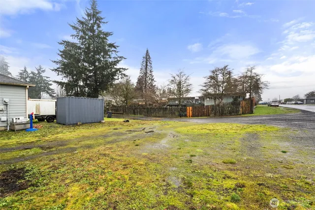 a backyard of a house with lots of green space