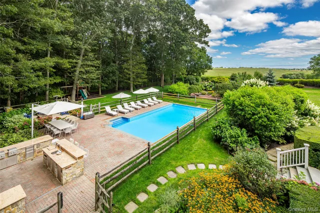 a view of yard with patio