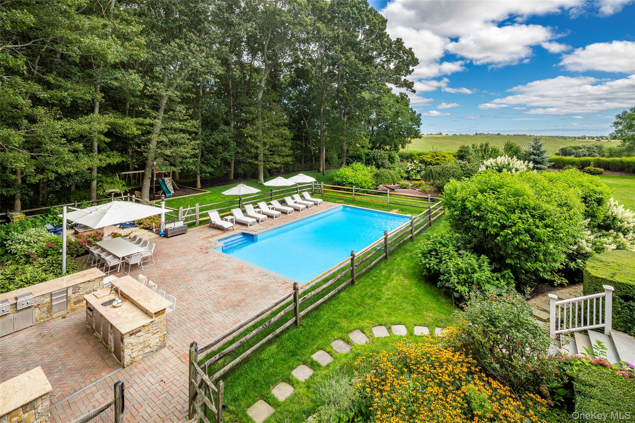 652 Noyac Path Water Mill, NY 11976 - Photo 23 of 41 View of pool with a patio area, a fenced in pool, playground community, fence, and a yard