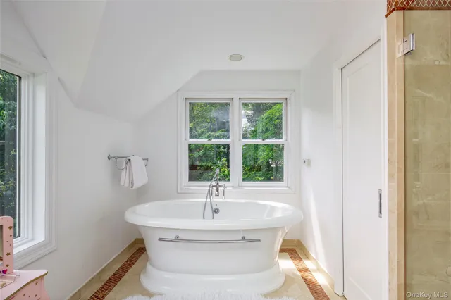 a bathroom with a sink and a window