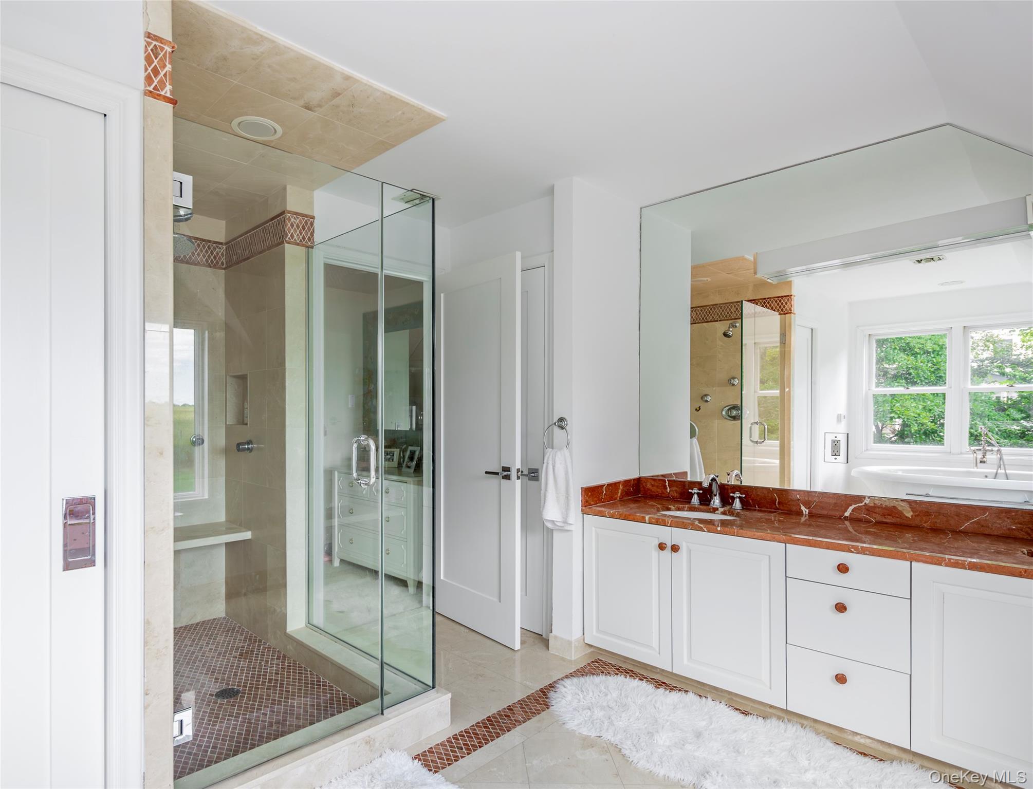 652 Noyac Path Water Mill, NY 11976 - Photo 26 of 41 Full bath with a stall shower, tile patterned flooring, and vanity