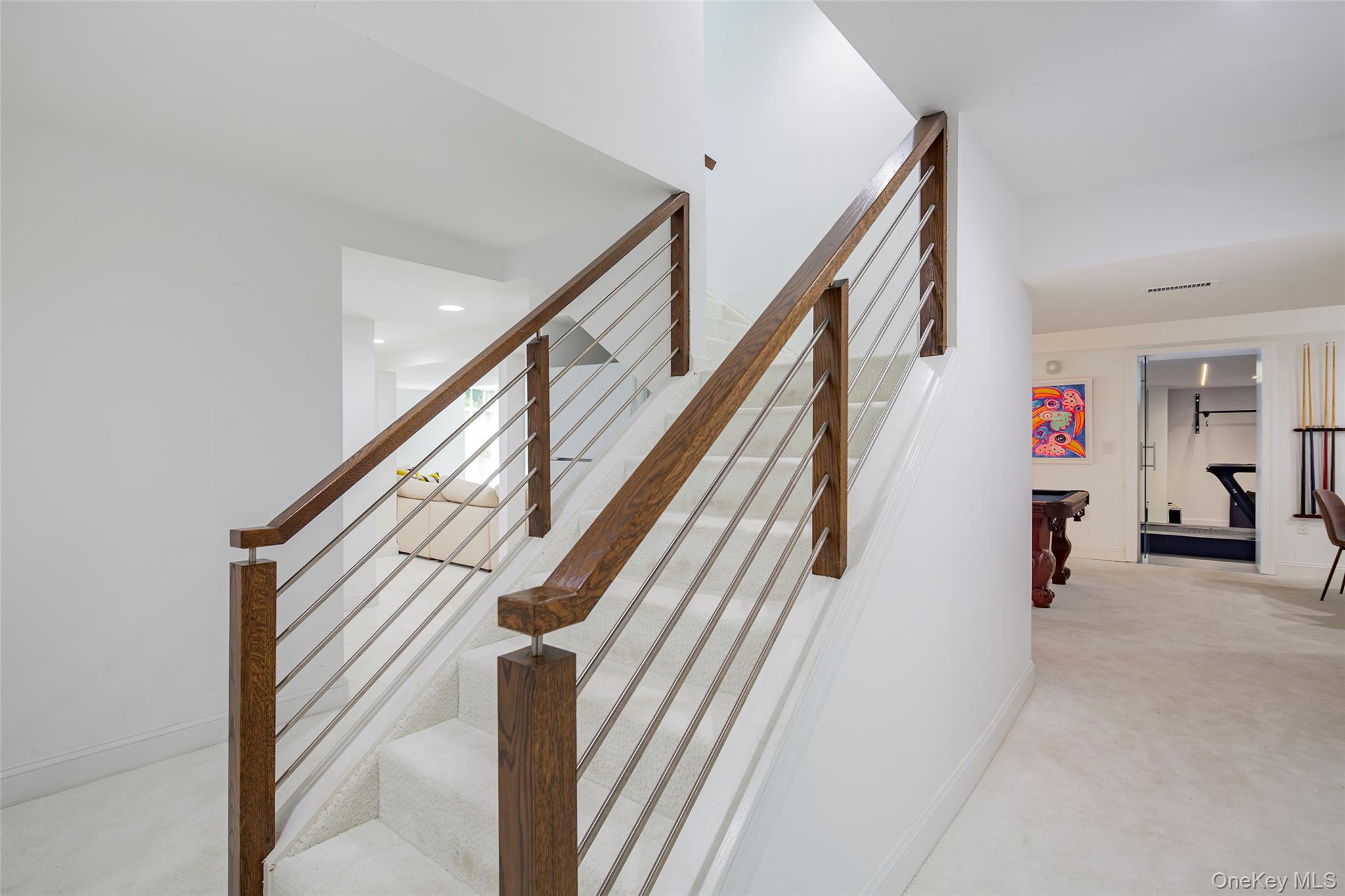 652 Noyac Path Water Mill, NY 11976 - Photo 28 of 41 Stairway with baseboards, visible vents, and carpet