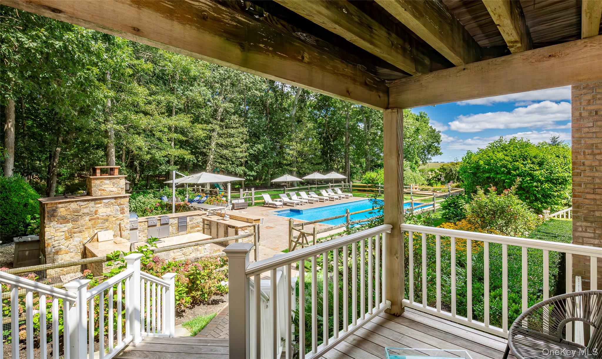 652 Noyac Path Water Mill, NY 11976 - Photo 38 of 41 Deck with a community pool and a patio area
