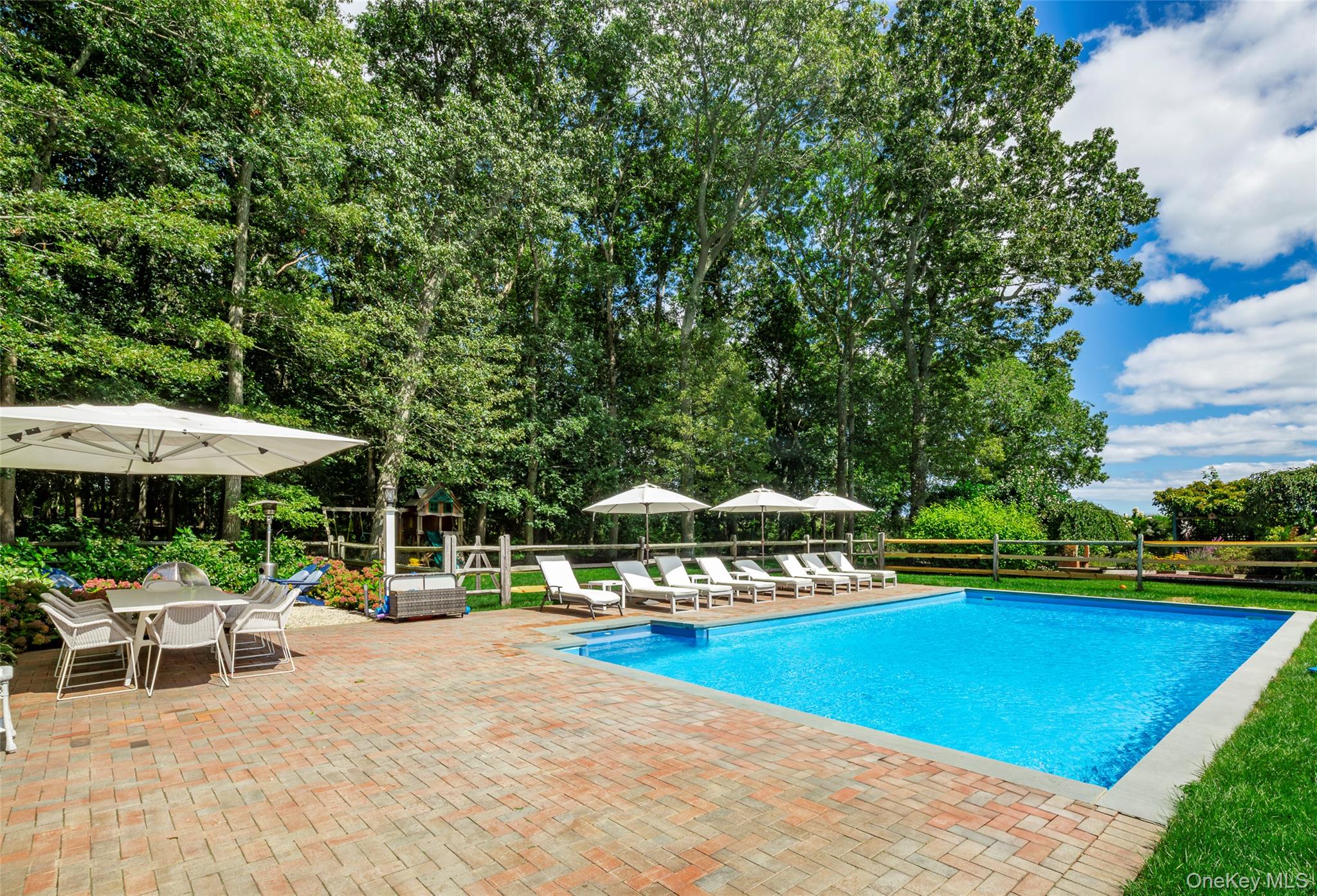 652 Noyac Path Water Mill, NY 11976 - Photo 40 of 41 View of swimming pool featuring a patio area, fence, and a fenced in pool