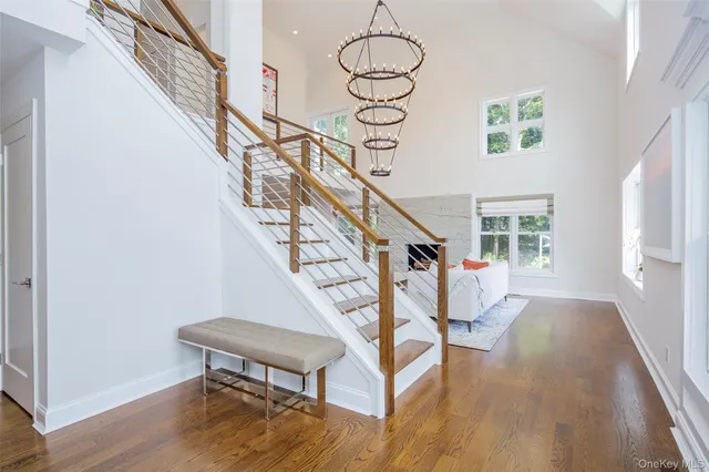 a view of entryway with wooden floor and stairs