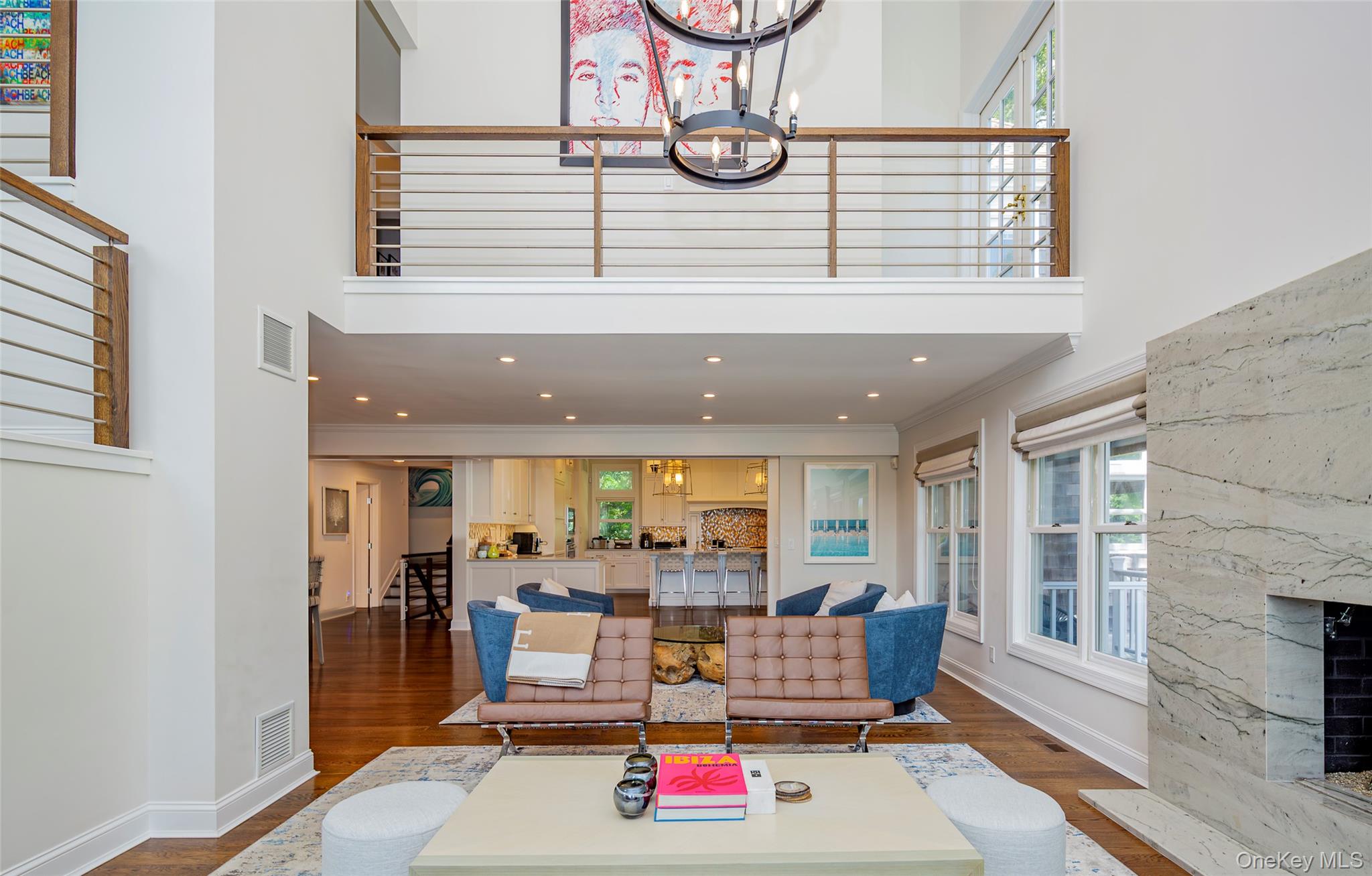 652 Noyac Path Water Mill, NY 11976 - Photo 9 of 41 Living area with a high ceiling, dark wood-type flooring, baseboards, visible vents, and ornamental molding