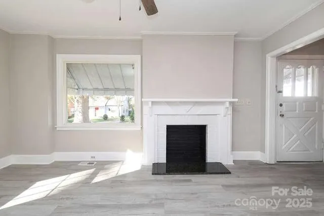 a living room with a fireplace and a window