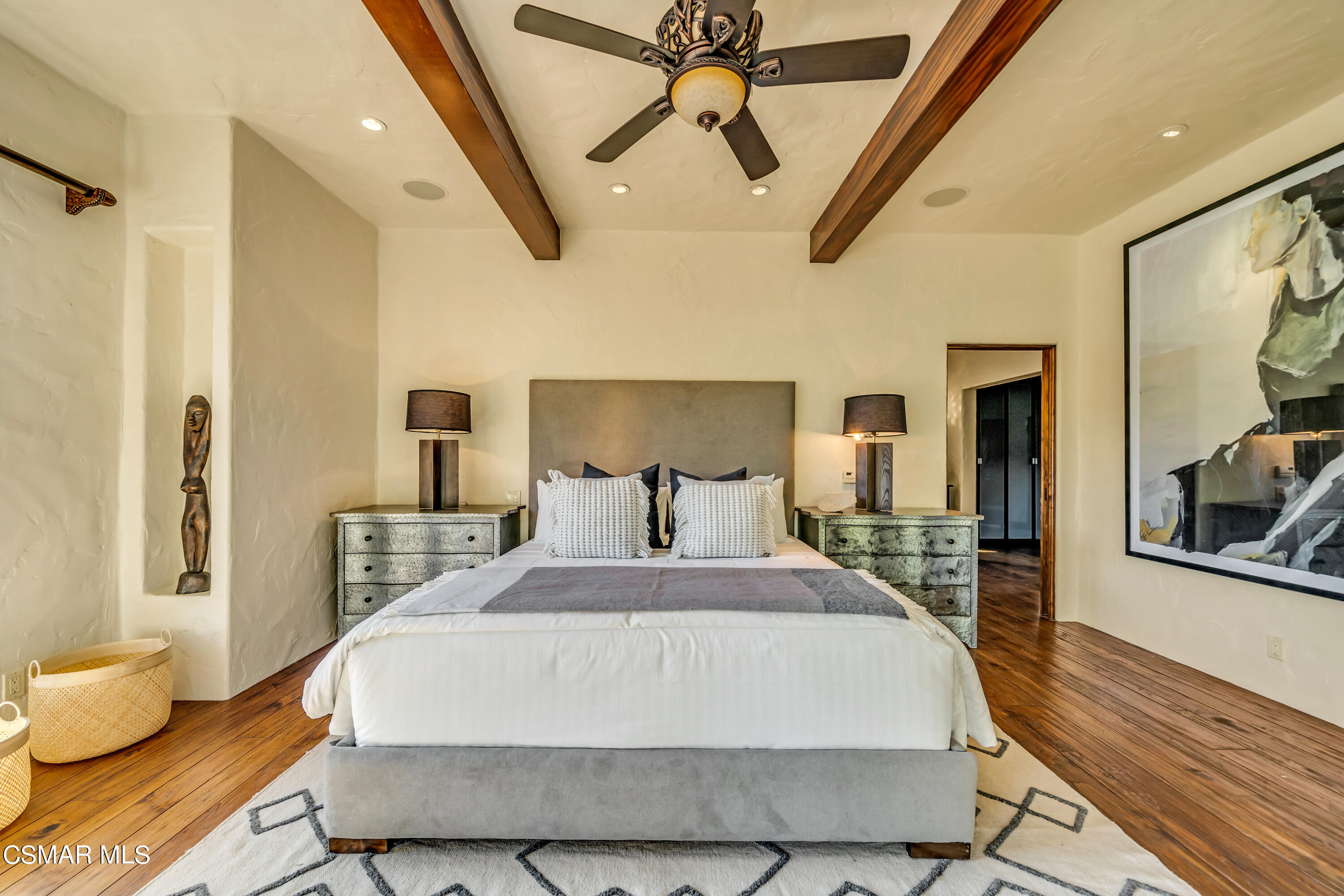 1999 Trentham Road Lake Sherwood, CA 91361 - Photo 24 of 61 a large bedroom with a bed and wooden floor