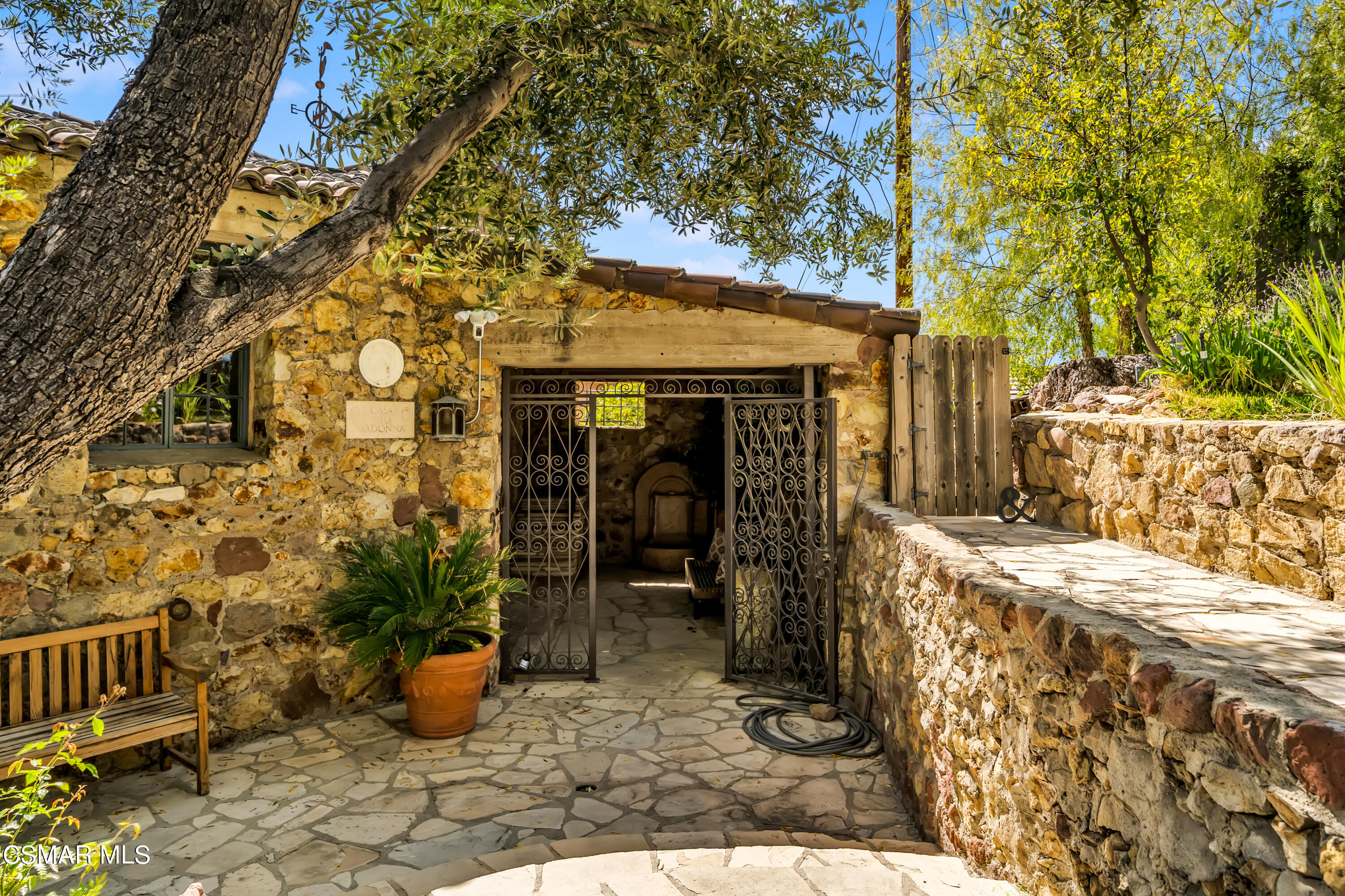 1999 Trentham Road Lake Sherwood, CA 91361 - Photo 42 of 61 a view of a patio with table and chairs and potted plants
