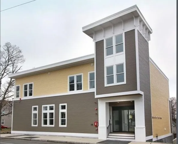 a front view of a house with glass windows