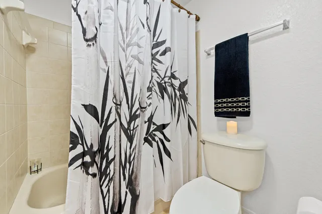 a bathroom with a toilet and a sink