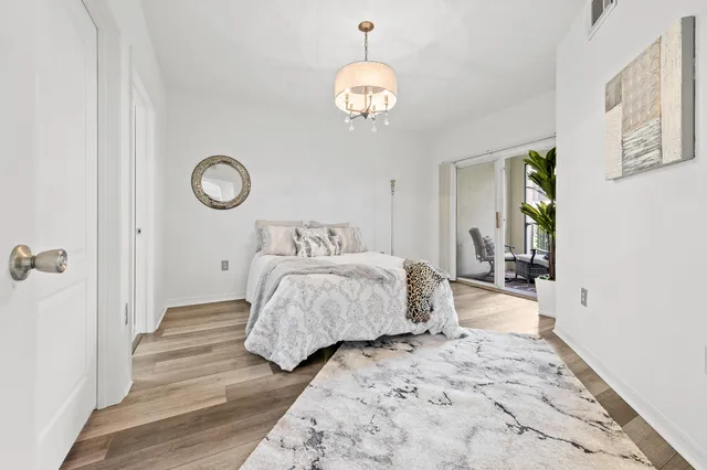 a bedroom with bed and a window