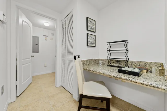 a hallway with sink and mirror