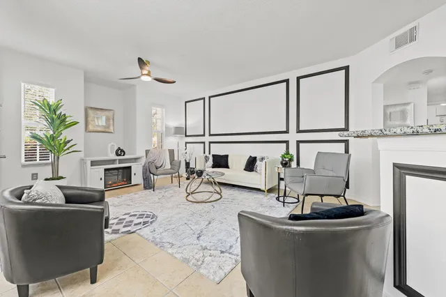 a living room with furniture and a table