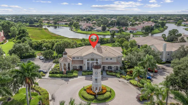 a aerial view of a house with swimming pool and mountain view in back