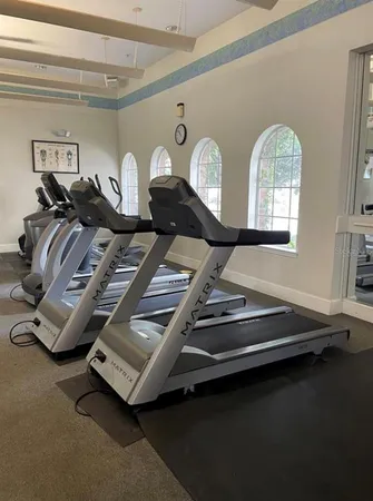 a view of gym equipment and a window